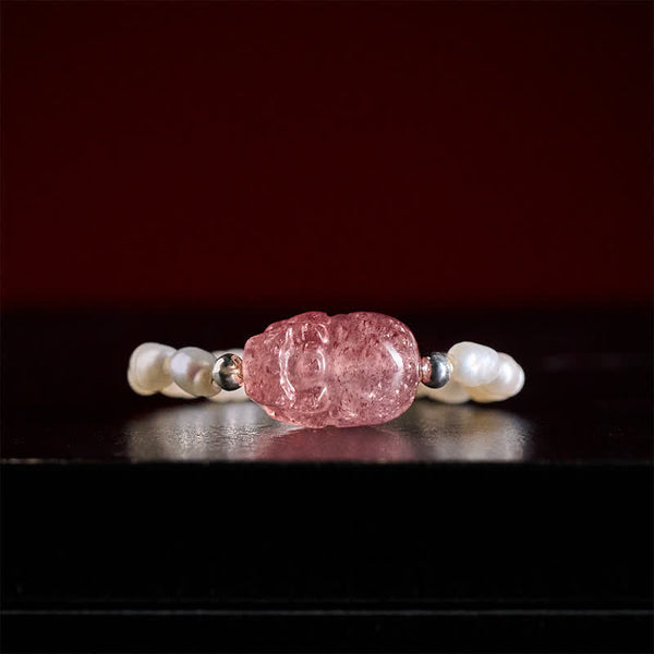 3mm PiXiu Gemstone Ring – Front view of PiXiu with freshwater pearls on dark surface, lustrous