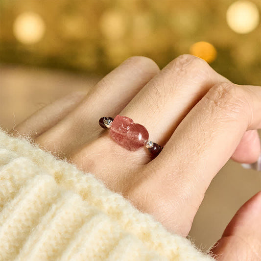 3mm PiXiu Gemstone Ring – Hand model wearing garnet PiXiu ring with cream sweater, boho style
