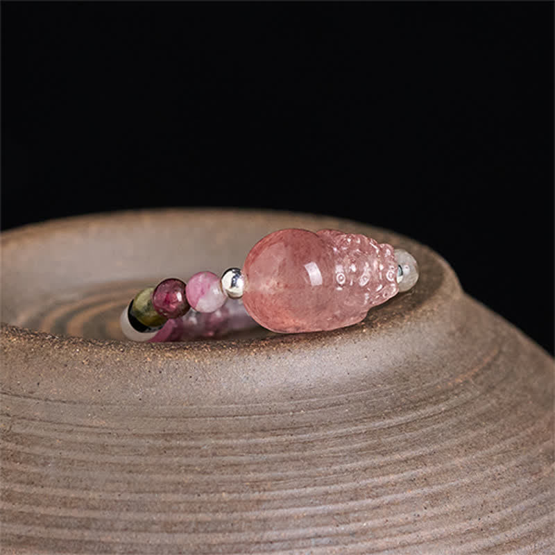 3mm PiXiu Gemstone Ring – PiXiu with tourmaline beads on textured ceramic dish, close-up detail