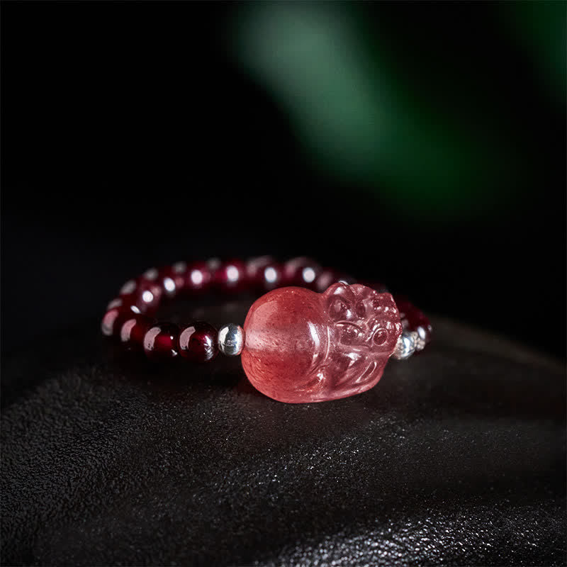 3mm PiXiu Gemstone Ring – Close-up of strawberry quartz PiXiu with garnet beads, dark background