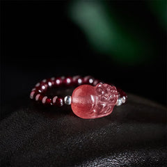 3mm PiXiu Gemstone Ring – Close-up of strawberry quartz PiXiu with garnet beads, dark background