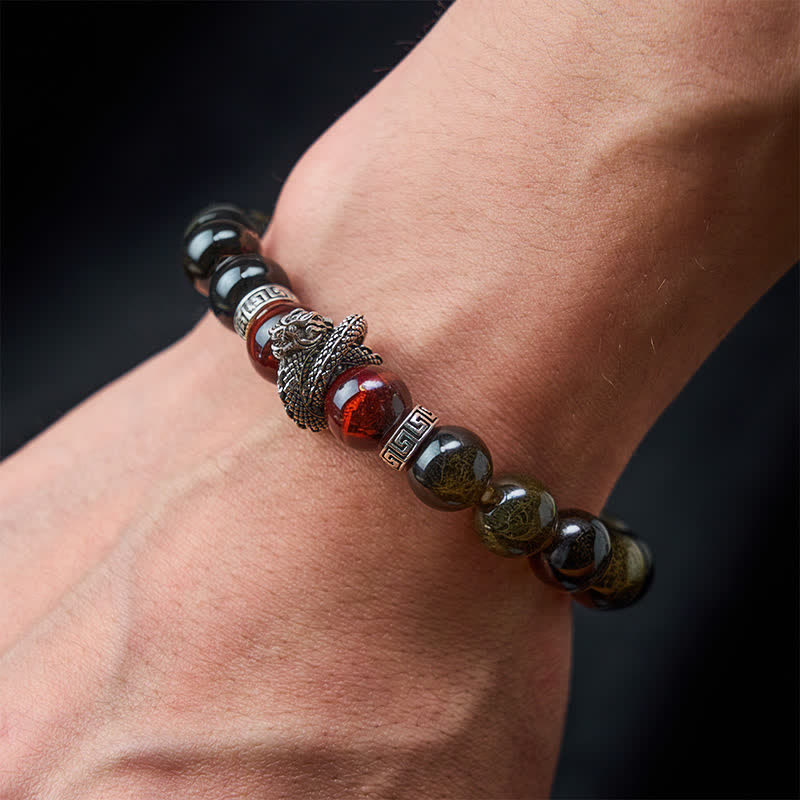 Silver Sheen Obsidian Red Tiger Eye Dragon Success Bracelet - on wrist gray background owl charm with tiger eye, wise