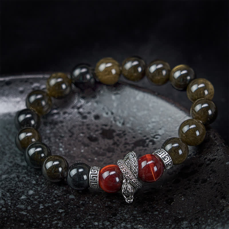 Silver Sheen Obsidian Red Tiger Eye Dragon Success Bracelet - on wrist close-up dragon focal with black background, striking
