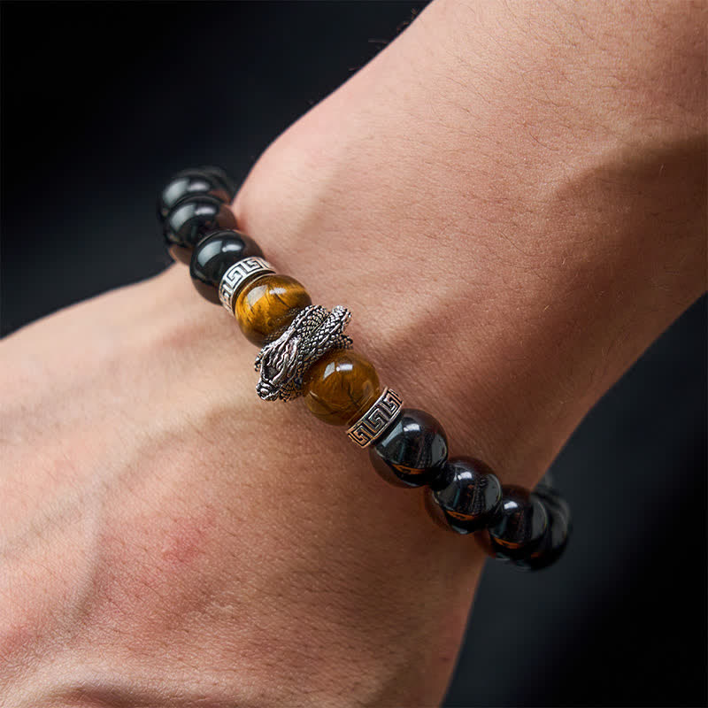 Silver Sheen Obsidian Red Tiger Eye Dragon Success Bracelet - on wrist gray background owl centerpiece, intuitive