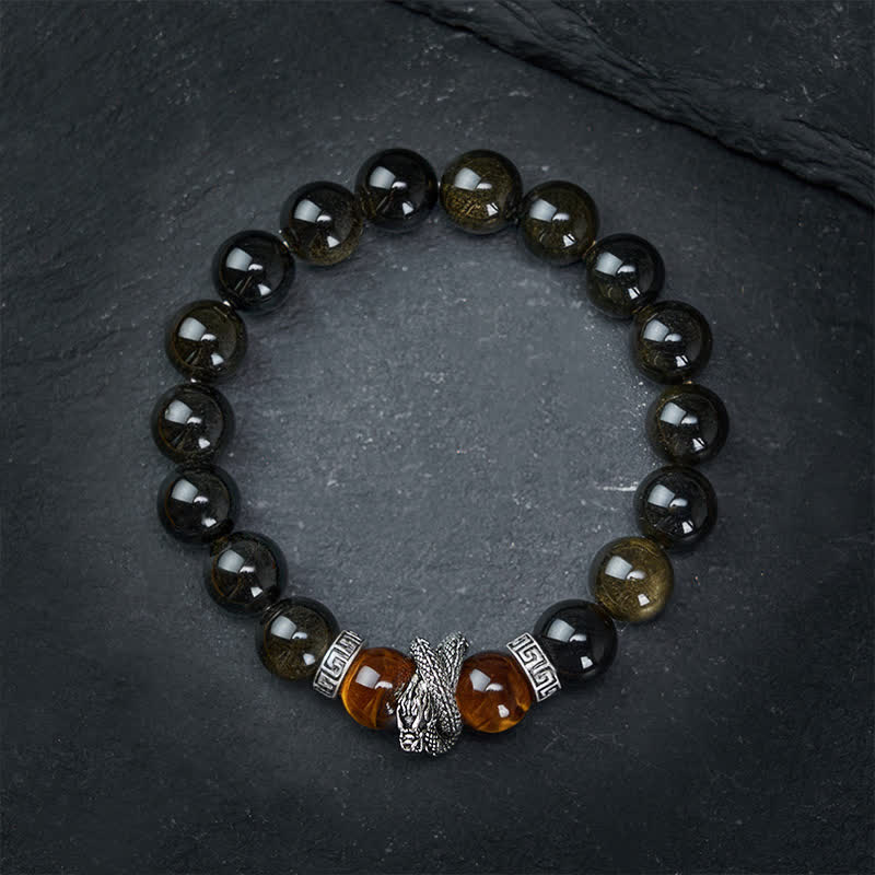 Silver Sheen Obsidian Red Tiger Eye Dragon Success Bracelet - low angle dramatic lighting dragon and amber beads, bold