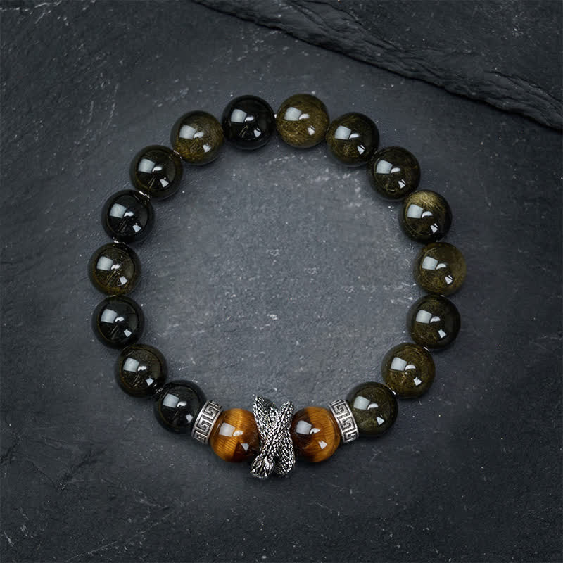 Silver Sheen Obsidian Red Tiger Eye Dragon Success Bracelet - top-down view dragon head centerpiece on textured stone, art...