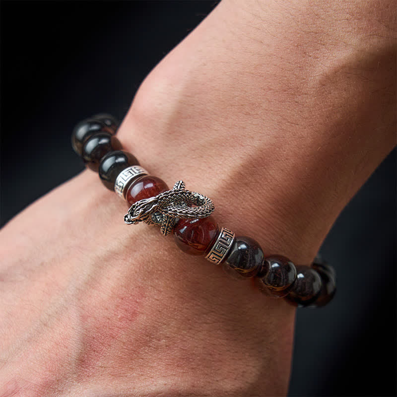 Silver Sheen Obsidian Red Tiger Eye Dragon Success Bracelet - on wrist dragon head detail black background, wearable