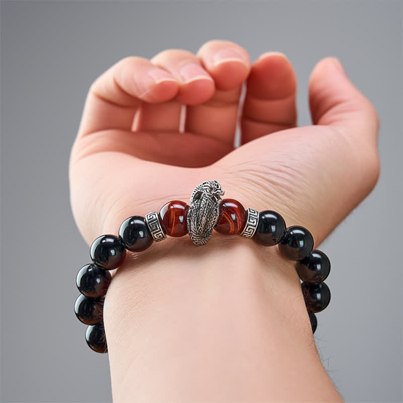 Silver Sheen Obsidian Red Tiger Eye Dragon Success Bracelet - on wrist close-up dragon scales and red stone glow, protective