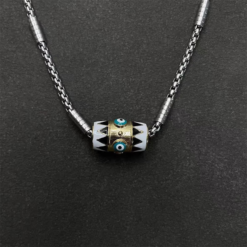 Evil Eye Pendant Necklace – Cylindrical evil eye bead with turquoise eyes on braided silver chain