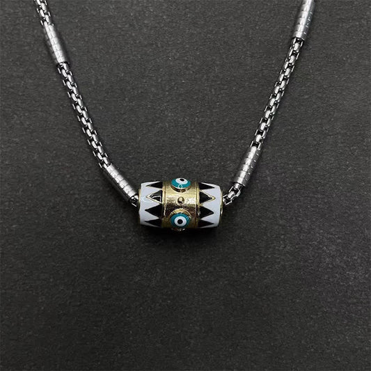 Evil Eye Pendant Necklace – Cylindrical evil eye bead with turquoise eyes on braided silver chain