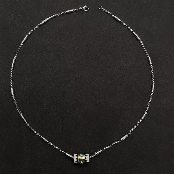 Evil Eye Pendant Necklace – Circular layout of copper enamel pendant necklace on matte black, evil eye detail