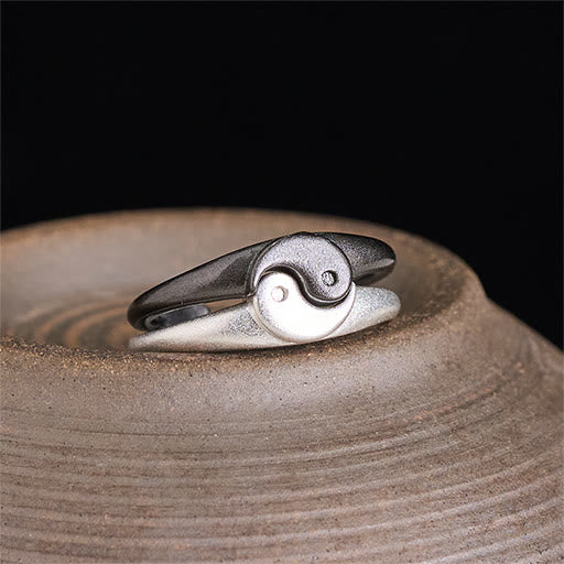 Yin Yang Copper Ring - Two-tone split rings on ceramic dish, oxidized and polished silver yin-yang