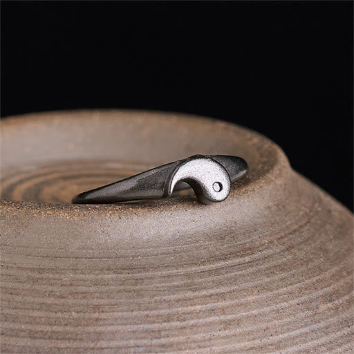 Yin Yang Copper Ring - Single ring on earthy ceramic vessel, gunmetal and silver artisan ring photo