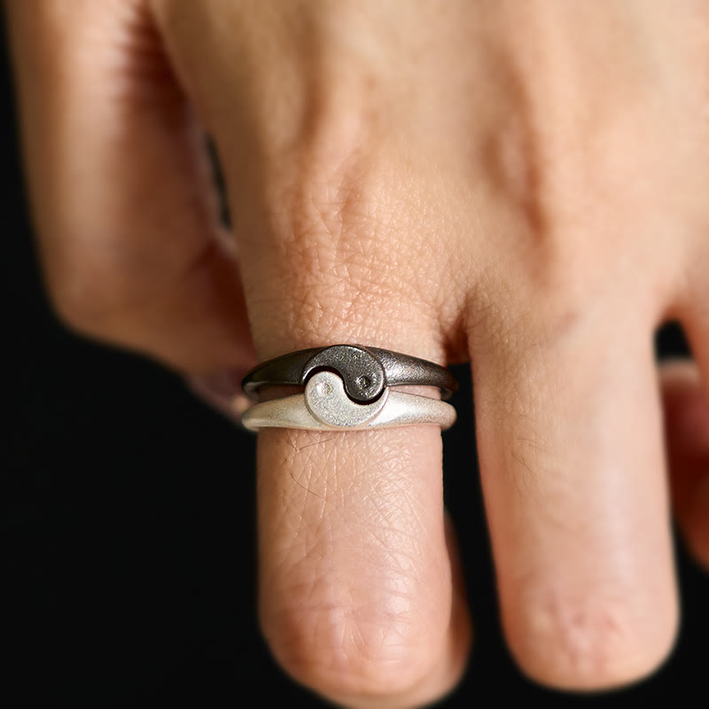 Yin Yang Copper Ring - Stacking rings worn on finger showing yin-yang design, black silver promise rings