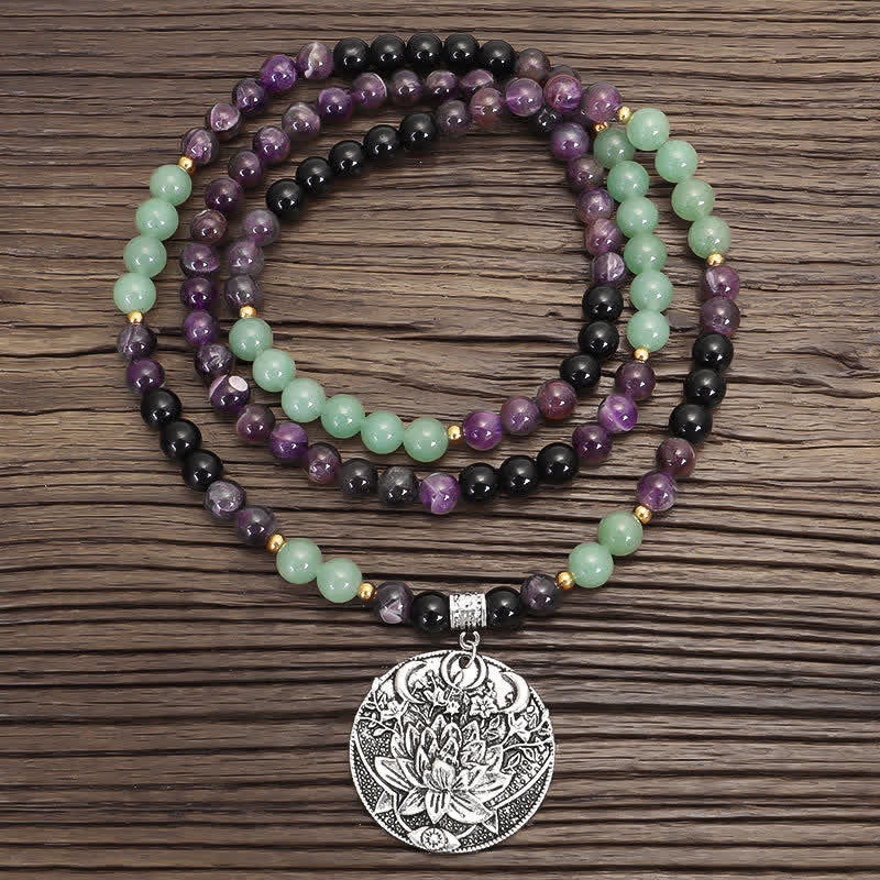 Amethyst Aventurine Lotus Mala - Triple-strand necklace with silver lotus pendant on wood, boho gemstone