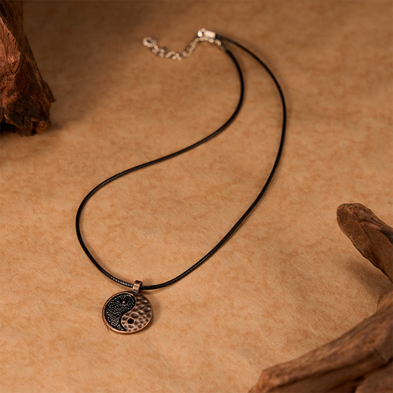 Vintage Yin Yang Necklace - leather cord pendant with lobster clasp on kraft paper, adjustable