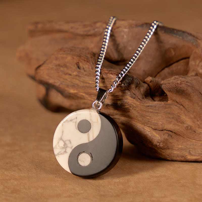 Yin Yang Obsidian Necklace - close-up of polished stone pendant with gray veining, healing crystal