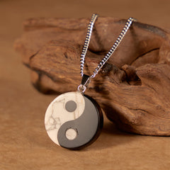 Yin Yang Obsidian Necklace - close-up of polished stone pendant with gray veining, healing crystal