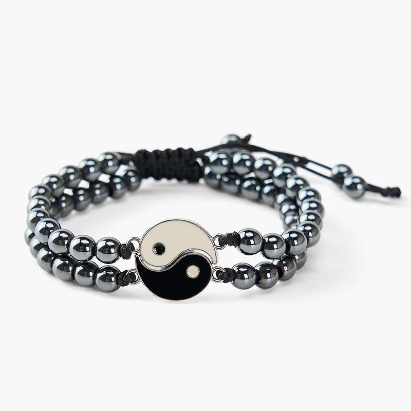 Hematite Lava Rock Yin Yang Bracelet - Double-row black bead bracelet with yin-yang charm on white background