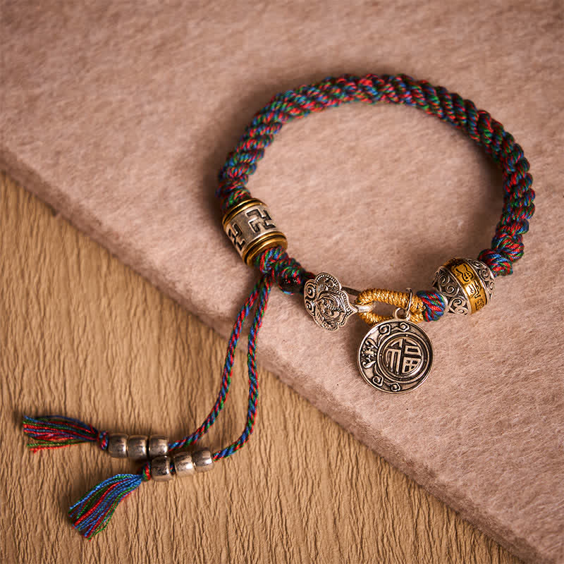 Fu Swastika Rope Bracelet - Handcrafted multicolor Tibetan braided bracelet with fortune blessing charm and adjustable tassel, spiritual jewelry