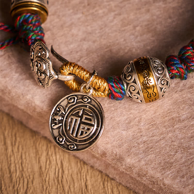 Fu Swastika Rope Bracelet - Red braided Tibetan prayer bracelet with silver Om mantra charm on hammered brass singing bowl, meditation jewelry