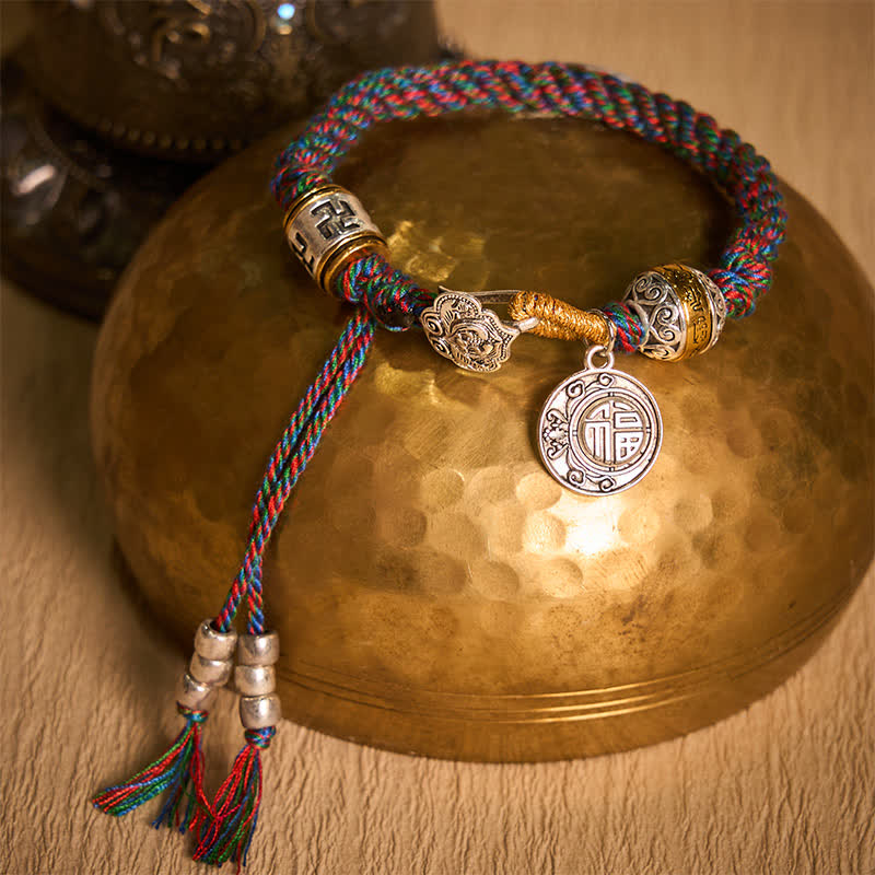 Fu Swastika Rope Bracelet - Multicolor braided bracelet with swastika bead and Fu fortune pendant on brass singing bowl, Buddhist jewelry
