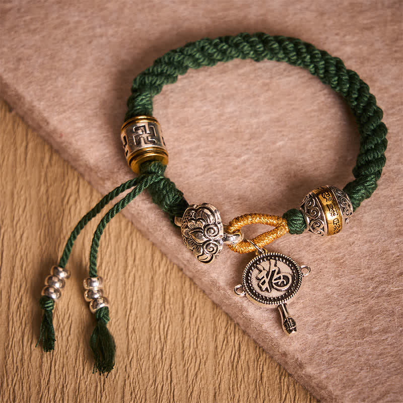 Fu Swastika Rope Bracelet - Tibetan Buddhist prayer wheel bracelet with green braided cord and silver gold engraved beads, adjustable spiritual jewelry