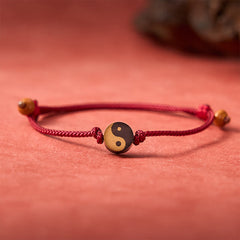 Ebony Yin Yang String Bracelet – gold black yin yang bead on braided red cord, taijitu jewelry