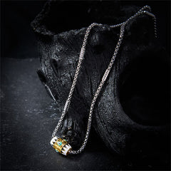 Evil Eye Pendant Necklace – Dual-tone barrel pendant with blue eye on volcanic rock, protective amulet