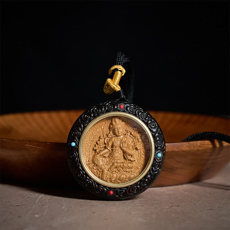 Sandalwood Jambhala Tara Necklace – pendant macro showing hand-carved details, sandalwood necklace, Jambhala pendant, Tara
