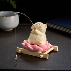 Lotus Animal Fishing Desk Decor - meditating cat figurine with fishing rod on pink lotus at desk, spiritual home accent