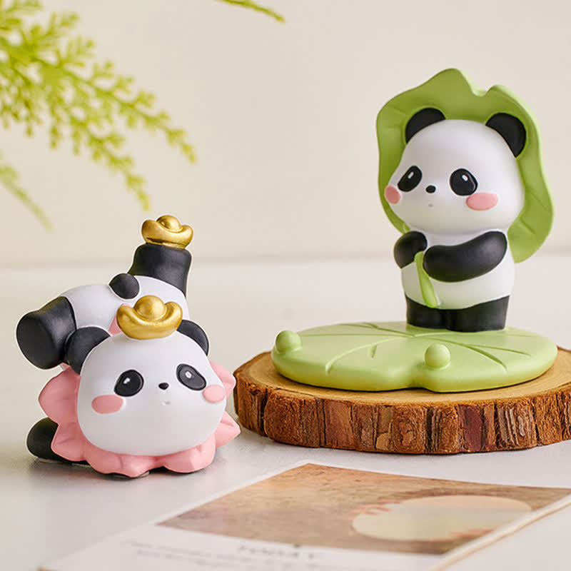 Resin Lotus Panda Phone Stand – Lotus leaf umbrella panda and reclining panda with gold phone slot on white shelf, functio...