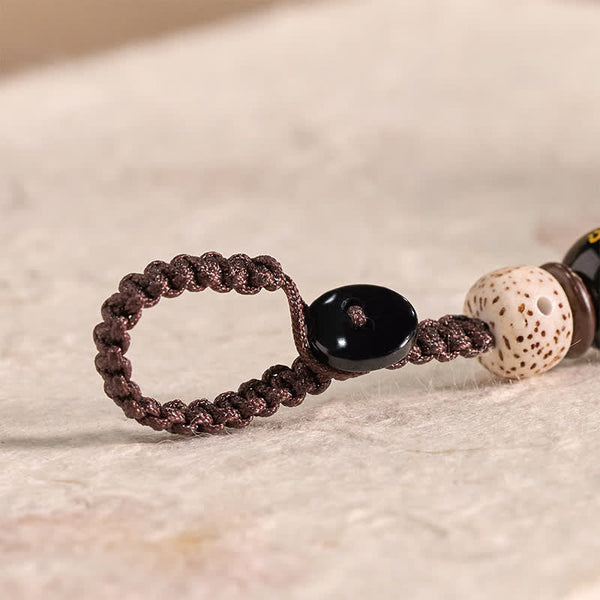 Wood Cat Keychain - Braided cord loop with Bodhi seed bead, black mantra bead, craft detail shot