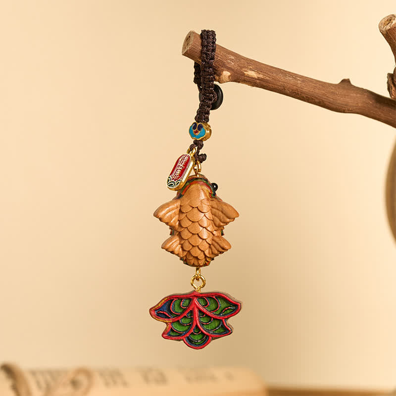 Rainbow Eucalyptus Koi Fish Keychain – carved wooden fish with enamel lotus leaf charm and peace tag on natural branch