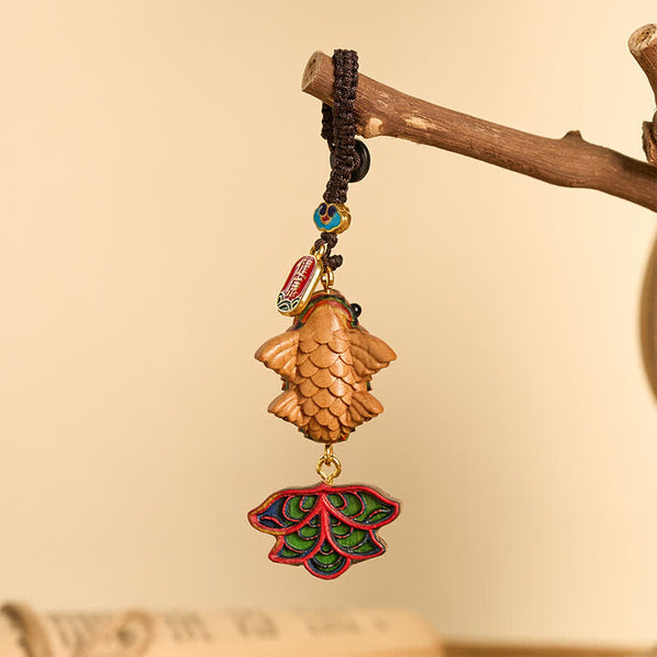 Rainbow Eucalyptus Koi Fish Keychain – carved wooden fish with enamel lotus leaf charm and peace tag on natural branch
