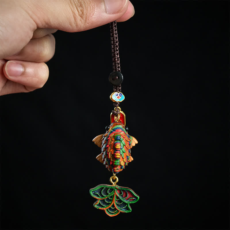 Rainbow Eucalyptus Koi Fish Keychain – multicolor embroidered koi fish pendant with cloud charm on black background