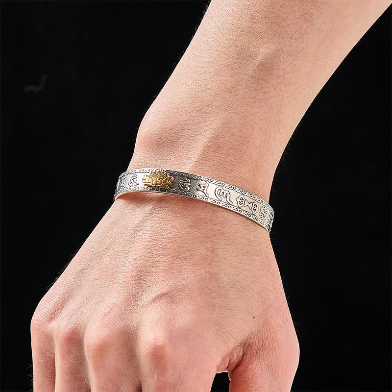 PiXiu Dragon Lotus Silver Bracelet – Gold lotus silver cuff worn on wrist, black background, spiritual