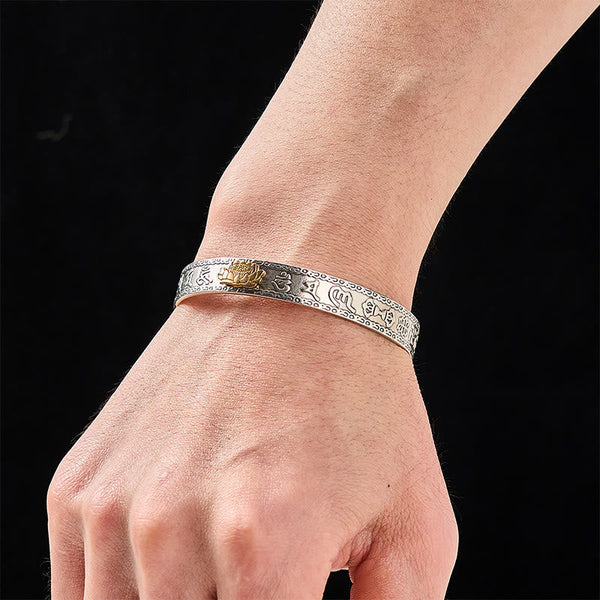 PiXiu Dragon Lotus Silver Bracelet – Gold lotus silver cuff worn on wrist, black background, spiritual