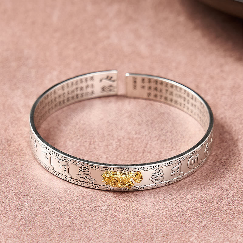 PiXiu Dragon Lotus Silver Bracelet – Top view silver cuff with gold dragon and sutra engraving, feng shui