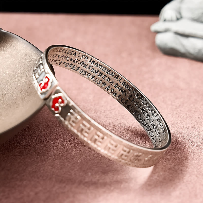 PiXiu Dragon Lotus Silver Bracelet – Close-up gold dragon charm on silver cuff bracelet, good luck
