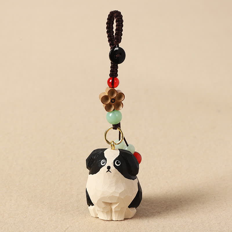 Wood Dog Keychain – Black and white carved dog with bronze flower charm and colorful stone beads, handcrafted Main image
