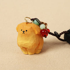 Carved Wood Dog Keychain – golden carved dog with red and green beaded accents, handmade keychain