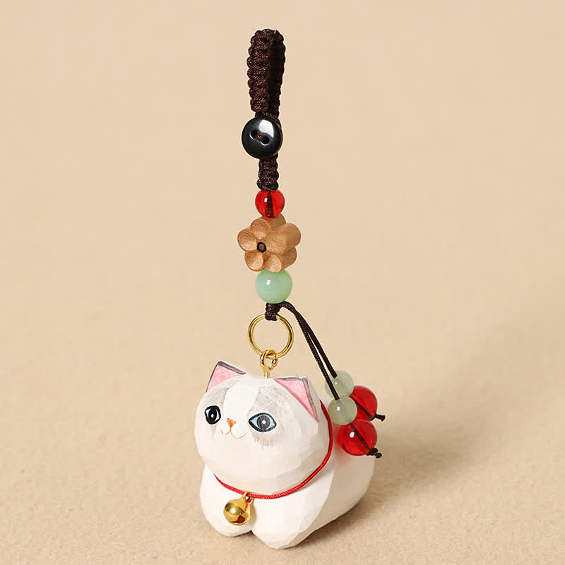 Wood Cat Keychain – White cat with blue and black heterochromia eyes and flower bead, hand-carved pendant