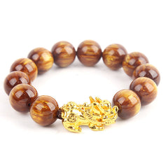 Golden Tiger Eye Bracelet – Round beads with gold PiXiu charm on white, wealth luck