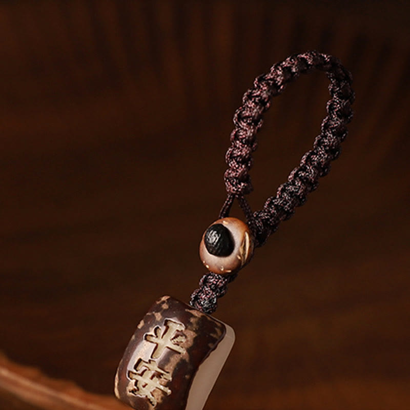 Sandalwood Money Bag Mantra Hanging - Carved wooden bead with peace text on cord