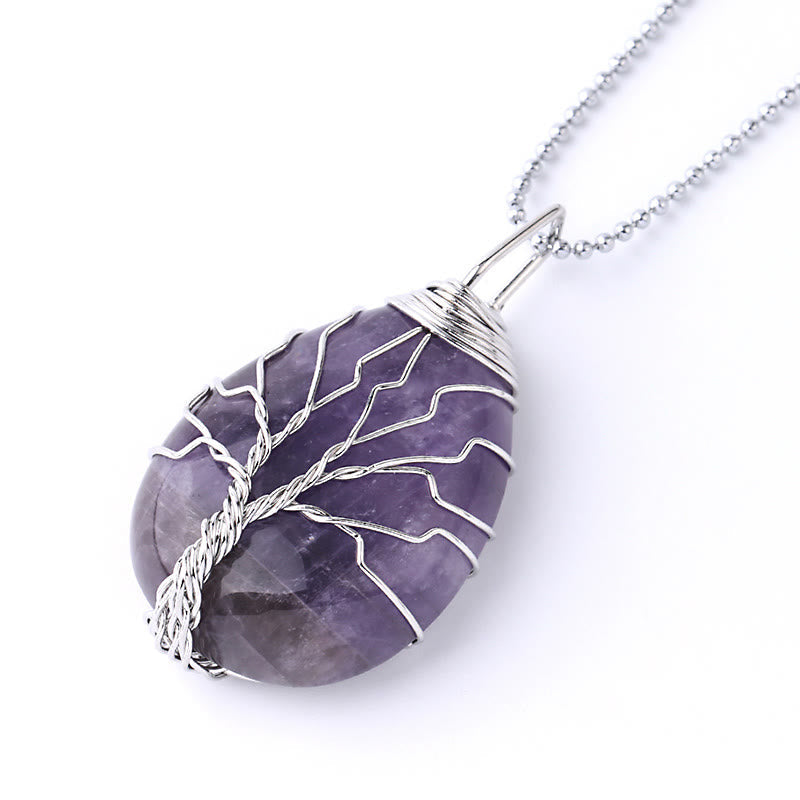 Quartz Crystal Tree of Life Necklace – amethyst pendant, silver wire tree, three-quarter angle, spiritual