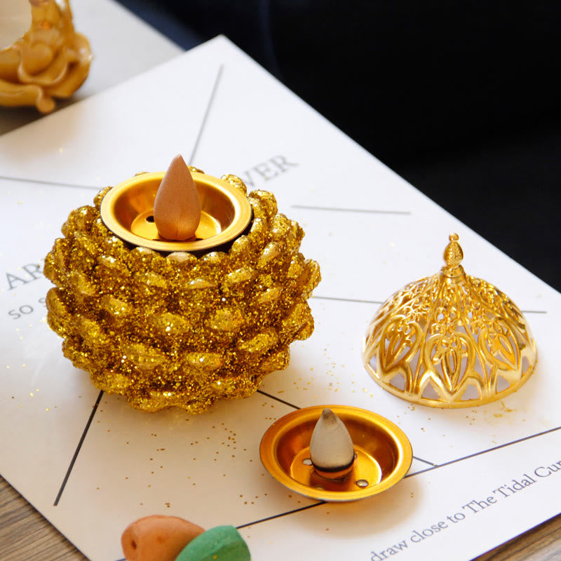 Gold Pine Cone Mini Incense Burner - Glitter sphere with lit cone, ornate lid, smoke trail, spiritual decor