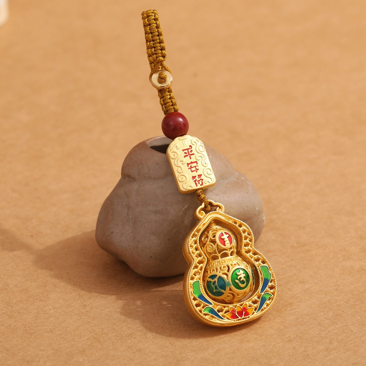 Gold enamel calabash keychain with peace talisman plaque and cinnabar bead, golden braided cord