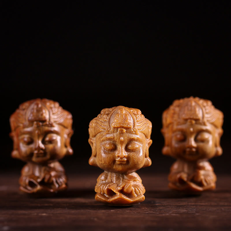 Chinese Zodiac Green Sandalwood Buddha – three carved wooden Buddha busts on dark wood, Handcrafted