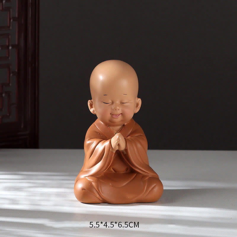 Mini Praying Monk Decor – smooth resin finish with matte orange saffron paint, Buddhist aesthetic